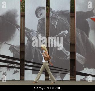 A woman walks by a poster dedicated to the Victory Day in central Minsk May 7, 2003. Belarus and other former Soviet republics will mark the victory of the Soviet Union over Nazi Germany in World War Two on May 9. Reuters/Vasily Fedosenko  CVI