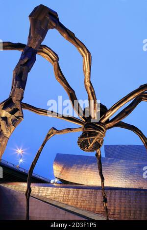 Guggenheim Museum and Spider sculpture called Maman by Louise Bourgeois, Bilbao, the Basque Country, Spain Stock Photo