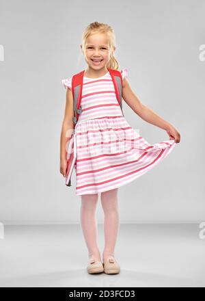 happy student girl with school bag waving hand Stock Photo - Alamy
