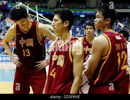 Chinese Players From L Yao Ming Guo Shiqiang Gong Xiaobin And Zhu Fangyu React After Losing To South Korea During The Men S Basketball Final At The 14th Asian Games In Pusan South