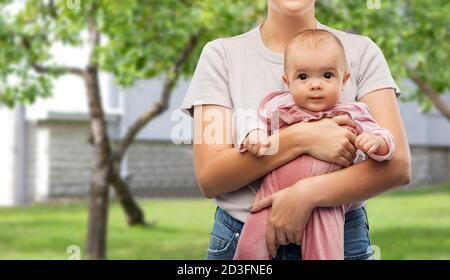 happy young mother holding little baby daughter Stock Photo