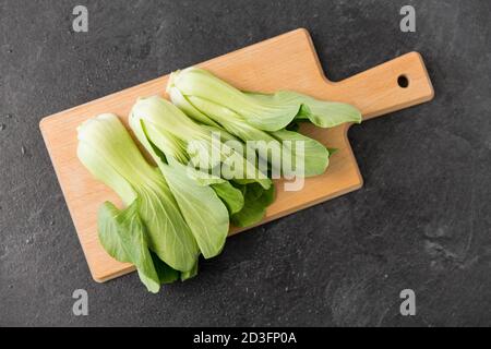 bok choy chinese cabbage on wooden cutting board Stock Photo