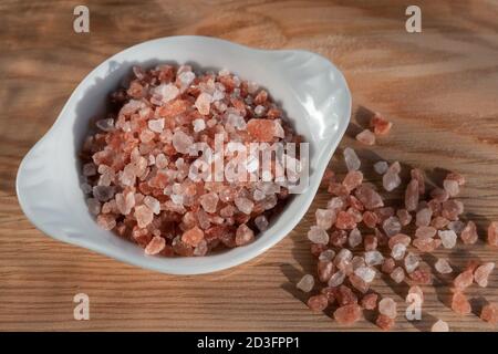 Pink himalayan salt on rustic background Stock Photo