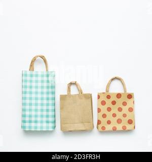 Paper shopping bags on white background. top view, copy space Stock Photo