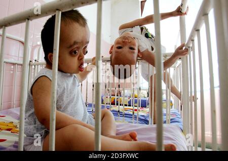 Young Vietnamese Disabled Victims Of Agent Orange Play In Their Cots In A Ho Chi Minh City Hospital February 25 05 On Monday A New York Court Will Begin Hearing A Lawsuit