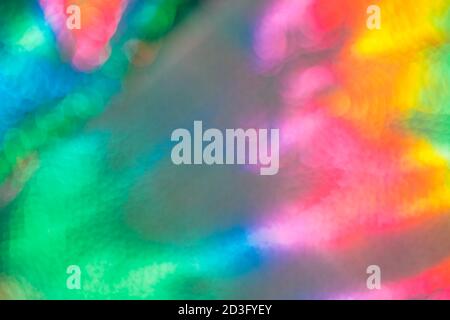 abstract colorful holographic futuristic rainbow textured defocused background. Stock Photo