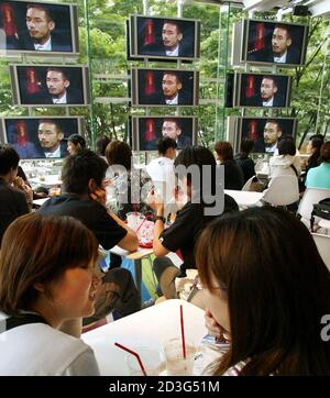 Japanese Soccer Fans Watch A Video Showing Japan S Midfielder Hidetoshi Nakata At The Nakata Net Cafe Run By Nakata In Tokyo May 30 02 The Cafe Offers Information For Soccer Fans From Throughout