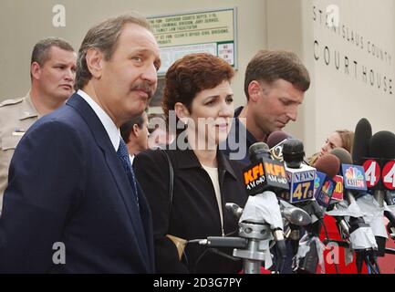 Los Angeles lawyer Mark Geragos (L), Suzan Peterson (C) and her husband talk to the press after a hearing in the Stanislaus County Courthouse in Modesto, California, May 2, 2003. High-profile criminal defense lawyer Geragos was appointed on Friday to represent Scott Peterson, who told a court last week he could not afford an attorney to defend himself against charges of murdering his wife Laci and their unborn child. Susan is the sister of Scott Peterson REUTERS/Tim Wimborne  TBW/GN