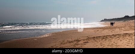 Horizontal picture of Montauk Beach looking west down the beach and ocean on a chilly April day during the pandemic in 2020. Stock Photo