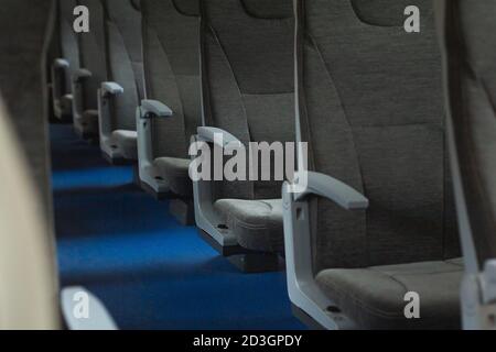 Railroad train interior. Rows of empty seats. Inside of russian suburban train Stock Photo