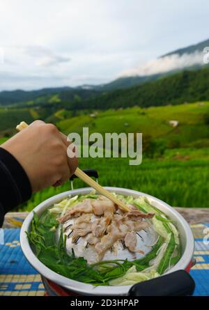 Moo Kata or Thai barbecue is grilld pork  with soup Stock Photo