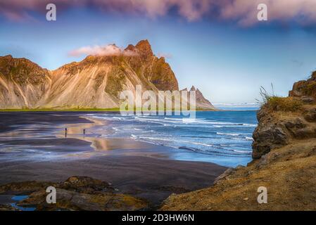 The wild and beautiful Vestrahorn mountain in early evening hours - Höfn, Iceland Landscape Stock Photo