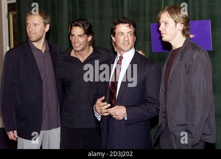 From left, director Renny Harlin, actors Christian de la Fuente, Sylvester Stallone and Kip Pardue, pose as they arrive for a Warner Bros. Pictures luncheon to promote the upcoming auto racing drama 'Driven' at the ShoWest Convention for theater owners at the Paris Las Vegas hotel-casino in Las Vegas March 8, 2001.  EM