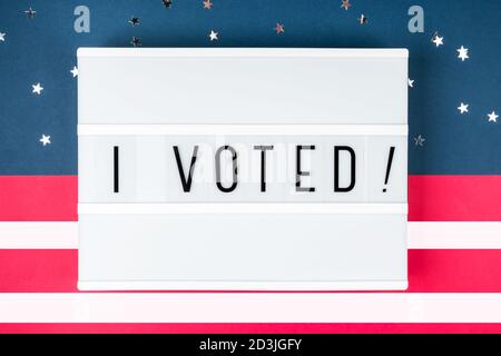 Lightbox with the words I VOTED on the background of the colors of the American flag Stock Photo