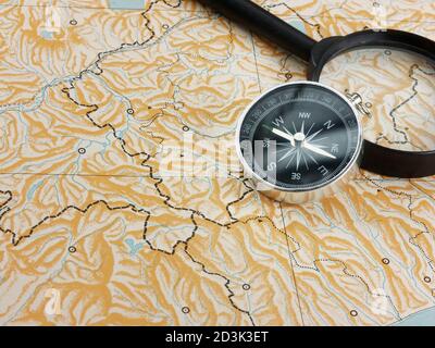 magnifying glass and compass on blank map copy space Stock Photo