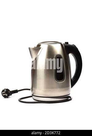 Electric kettle with stand isolated on white background. Electric cord with plug. Stock Photo