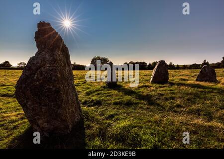 The backlit Duloe Stone Circle in Cornwall, England Stock Photo