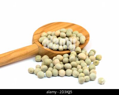 Dried peas on a wooden spoon Stock Photo