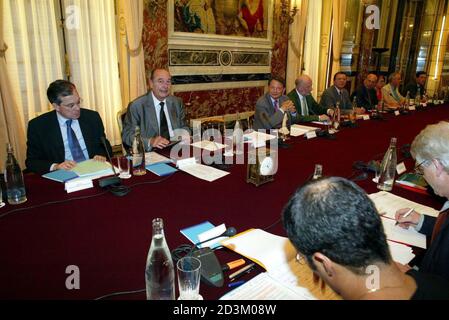 French President Chirac and former health Minister Mattei attend a meet with NGOs and local collectivities representatives at Marigny Hotel in Paris.  French President Jacques Chirac (2nd L) and Former health Minister Jean Francois Mattei (R) attend a meeting with non-governmental organizations and local collectivities representatives to prepare the coming G8 summit, at the Marigny Hotel in Paris, June 28, 2005. REUTERS/Emmanuel Fradin