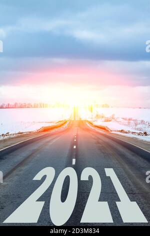 New year theme. The year 2021 is written on the road. All the good is ahead. Stock Photo