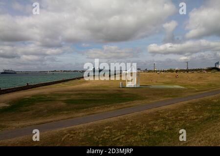 Southsea, the bandstand with in the background the new aircraft carrier Queen Elizabeth Stock Photo