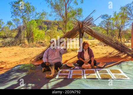 Kings Creek Station, Northern Territory, Australia - Aug 21, 2019: Australian Aborigines show bush seeds and medicine plants. Karrke Aboriginal Stock Photo