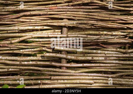 Organic woven willow wicker fence panel , close up texture. Stock Photo