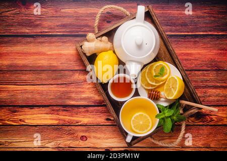 Green tea with lemon honey, ginger and mint, Immunity boosting and cold remedies, top view. Stock Photo
