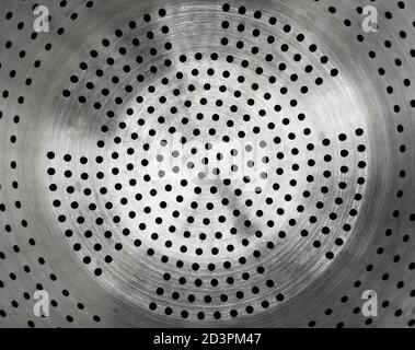 Close-up of stainless steel colander. Silver metal strainer Stock Photo