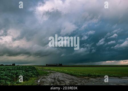 Wild skies of an autumn rain shower over the dutch landscape Stock Photo