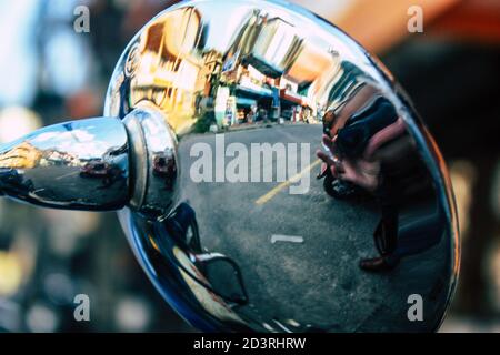 Closeup of a motorcycle rolling in the streets of the city center of the metropolitan area Stock Photo