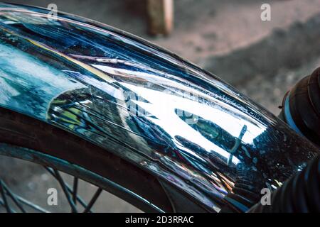 Closeup of a motorcycle rolling in the streets of the city center of the metropolitan area Stock Photo