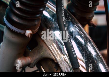 Closeup of a motorcycle rolling in the streets of the city center of the metropolitan area Stock Photo