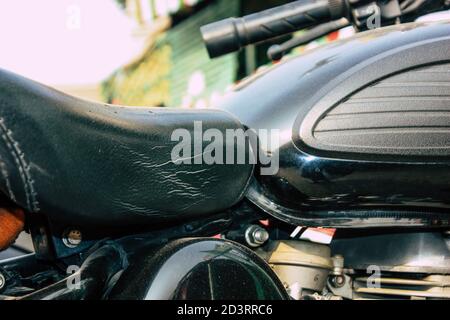 Closeup of a motorcycle rolling in the streets of the city center of the metropolitan area Stock Photo