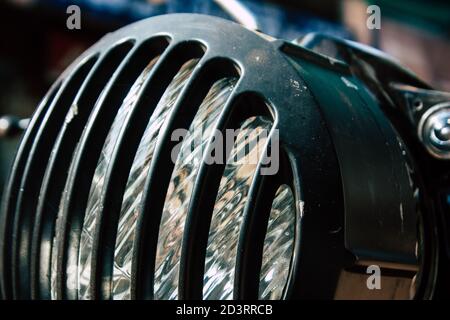 Closeup of a motorcycle rolling in the streets of the city center of the metropolitan area Stock Photo