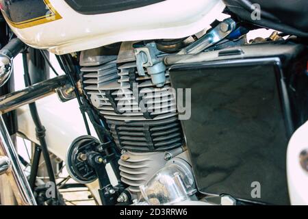 Closeup of a motorcycle rolling in the streets of the city center of the metropolitan area Stock Photo