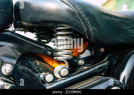 Closeup of a motorcycle rolling in the streets of the city center of the metropolitan area Stock Photo