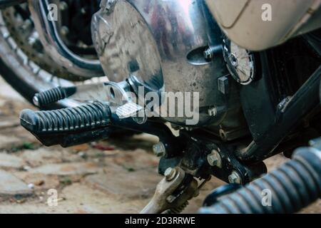 Closeup of a motorcycle rolling in the streets of the city center of the metropolitan area Stock Photo