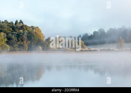 Misty morning at sunrise in autumn. Stock Photo