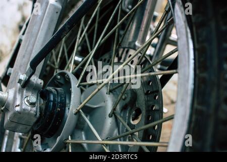 Closeup of a motorcycle rolling in the streets of the city center of the metropolitan area Stock Photo