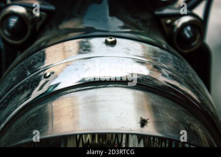 Closeup of a motorcycle rolling in the streets of the city center of the metropolitan area Stock Photo