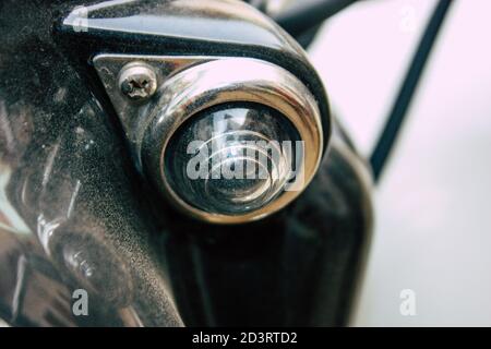 Closeup of a motorcycle rolling in the streets of the city center of the metropolitan area Stock Photo