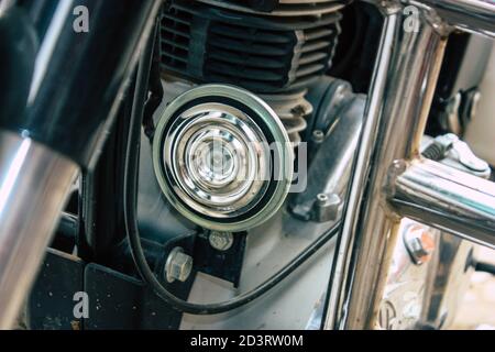 Closeup of a motorcycle rolling in the streets of the city center of the metropolitan area Stock Photo