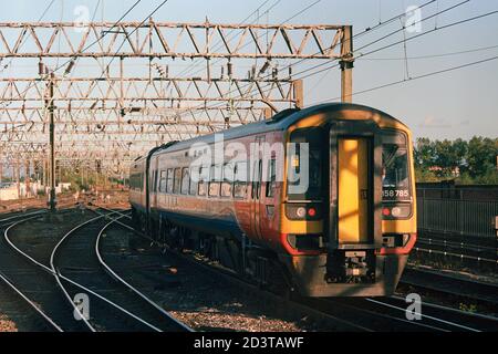 Manchester, UK - 19 Sep 2020: A passenger train (Class 158) operation by East Midlands Railway at Manchester Piccadilly station for express service. Stock Photo
