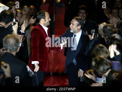 . designer Tom Ford (L) salutes Gucci President delegate Domenico Del  Sole (R) at the end of French fashion house Yves Saint Laurent 2004-2005  Autumn/Winter ready-to-wear fashion collection in Paris, March 7,