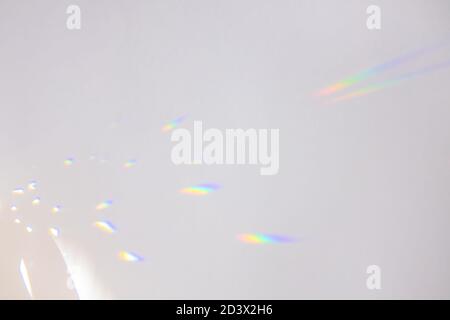 Bright iridescent highlights on a neutral gray background. Stock Photo