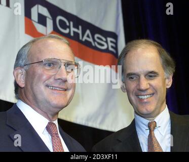 J P Morgan Chairman And Chief Executive William Harrison L Shakes Hands With Bank One S Chairman And Ceo Jamie Dimon R At A News Conference In New York January 15 04 They Announced