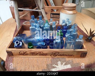 Old blue bottles in a wooden tray, Bromsgrove Worcester, Worcestershire.  England, UK,United Kingdom, 07/09/2020 Old blue bottles in a wooden tray, id Stock Photo