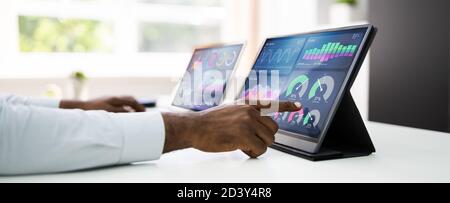 Predictive Business Analytics. African American Analyst Using Computer Stock Photo