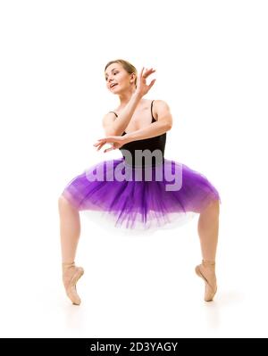 woman in purple tutu and black leotard dance ballet. Studio shot on white background , isolated images. Stock Photo